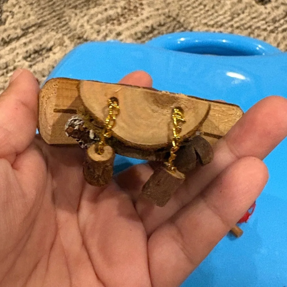 Christmas ornament depicting a wooden bird house clock